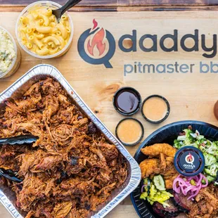 a tray of pulled pork, coleslaw, coleslaw, coleslaw,