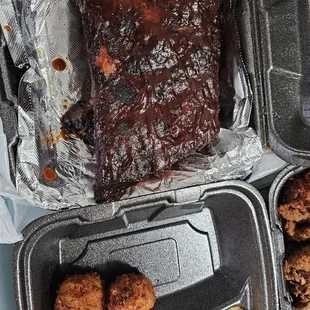 Take out ribs meal with double mac n cheese and hush puppies