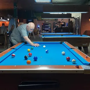 a man playing pool