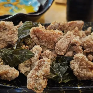 a plate of fried chicken and greens