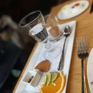 a plate of food and a glass of water