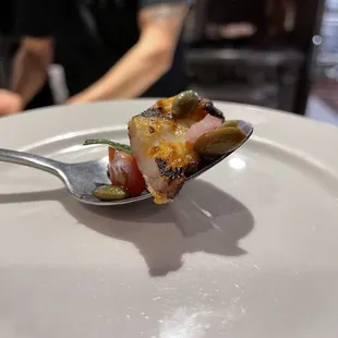 a spoon with food on it