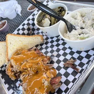 Pulled pork with potato salad &amp; collard green with yummy Carolina gold bbq sauce on top!