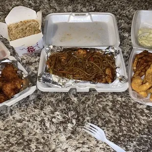 Cream Cheese Puffs, General Q chicken, Vegetable Rice, Seafood Noodles, Fried Shrimp and Fish plate.