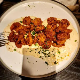 There twist on grits with fried shrimp