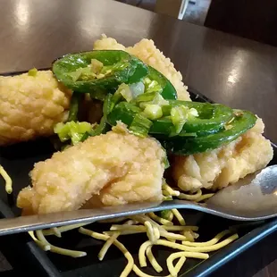 Salted Calamari.  It's ~$8.00.  Big Chunks That Would Be Better Served As Small Rings.