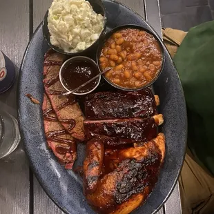 Brisket, ribs, chicken, baked beans, and potato salad