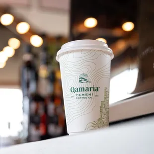 a cup of coffee on a counter