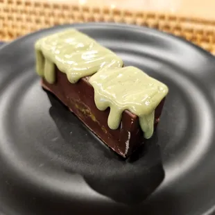 Dubai Chocolate - underneath the chocolate and pistachio icing is an Arab-style coconutty spice cake thing, awesome