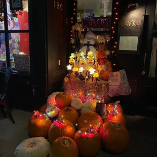 a display of pumpkins and other decorations
