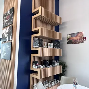Modern wall shelf with products for purchase