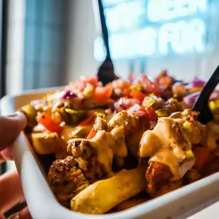 a person holding a bowl of food