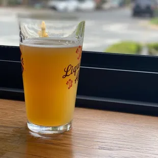 a glass of beer on a table