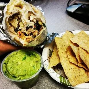 Regular burrito with guac and chips.