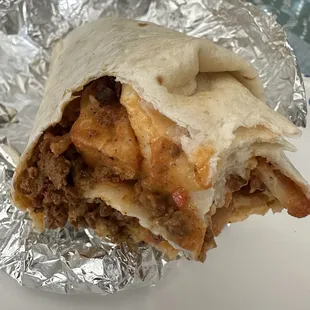 Build your own, potatoes, eggs, chorizo, bacon, queso, salsa hot. It was very good.