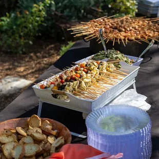 a variety of food on skewers