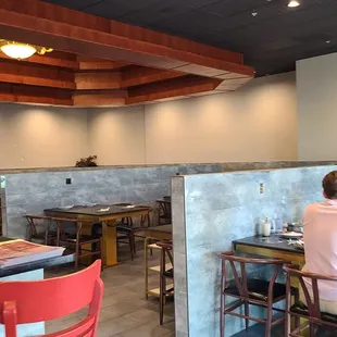 a group of people sitting at a table in a restaurant