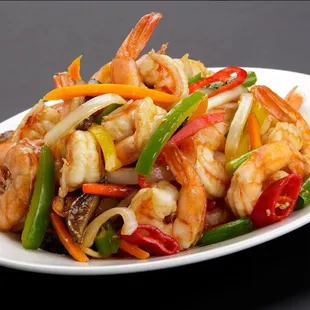 a plate of stir fried shrimp and vegetables