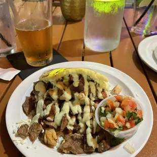 Steak, chicken, and sausage Arepa