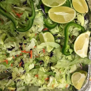 a salad with limes and peppers