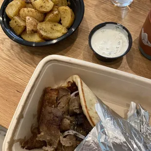 Gyros Pita Wrap and Oven Roasted Potatoes plus extra side of Tzatziki - so good