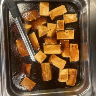 tofu being cooked in a pan