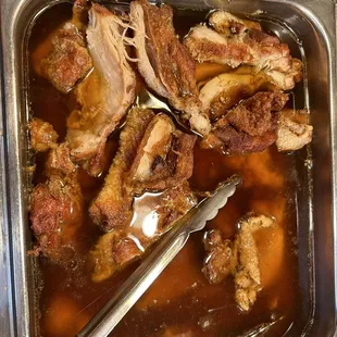 a tray of food with a spoon in it