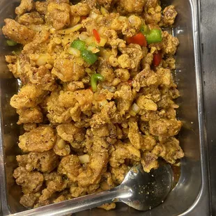 a bowl of food with a spoon in it