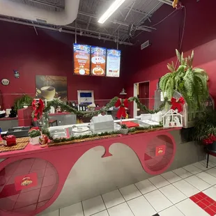 a restaurant counter decorated for christmas
