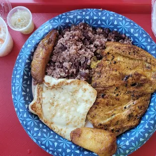 Grilled chicken with beans and rice. Fried cheese and fried platain