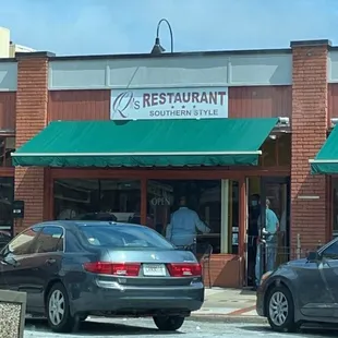 cars parked in front of the restaurant