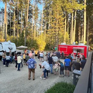 a large group of people at a food truck