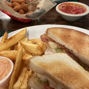 Cheese balls with marinara appetizer, chicken bacon ranch wrap, BLT sandwich, both plates came with seasoned home fries and dip.