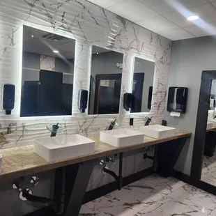 public restroom with sinks and mirrors