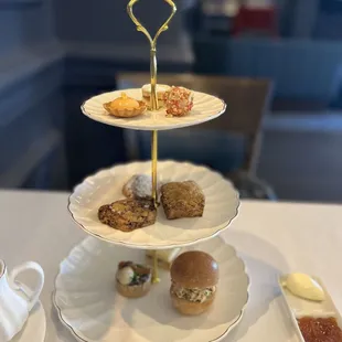 three tiered trays of pastries on a table