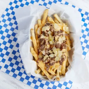 Try our Phanatic Fries!  Hand cut, skin on french fries with cheese whiz and marinated rib eye steak.  Enough to share!