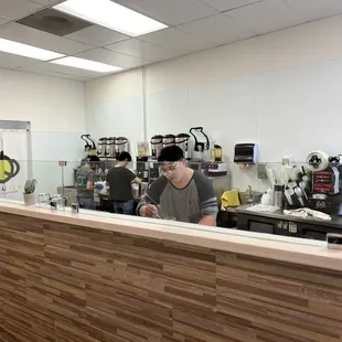 a man working in a coffee shop