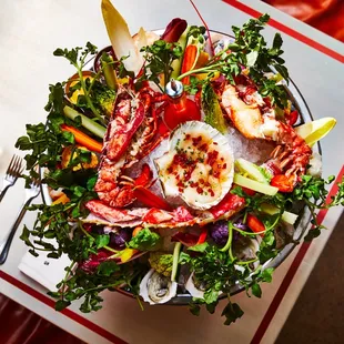 a plate of seafood and vegetables