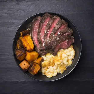 steak, potatoes, and macaroni