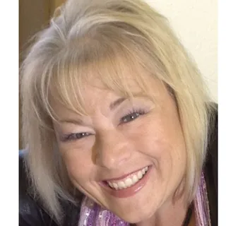 Christi M.