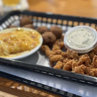 Oyster strips Mac and cheese and hush puppies
