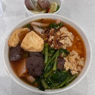 a bowl of soup with meat and vegetables