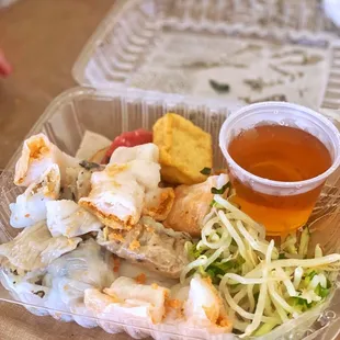 a plastic container with a variety of food items