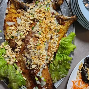 a plate of fish and salad