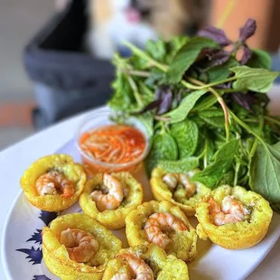 Bánh Khọt: Viet Mini Pancakes w/ shrimp, mung beans, lettuce, herbs, nước chấm | $15 (posted menu states, $14)