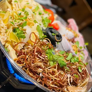 a plate of noodles and vegetables