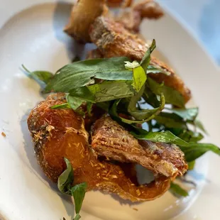 a plate of fried chicken and greens