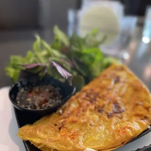 an omelet with a side of salad
