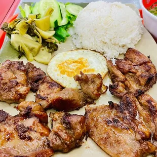 chicken, rice, and vegetables on a tray