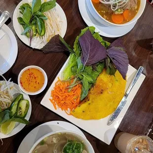 Pho Dac Biet (Bottom), Hủ Tiếu Bò Kho (Top), Bánh Xèo without pork (Middle), and Vietnamese iced coffee